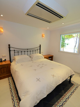 Bright, modern bedroom at Casa Claveles holiday villa for rent