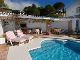 The Andalucian style BBQ is located next to the pool