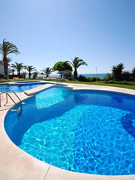The pool area overlooks the Mediteranean