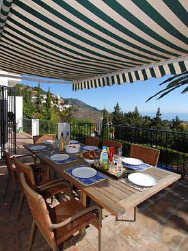 The terrace at Villa Veleta overlooks the pool